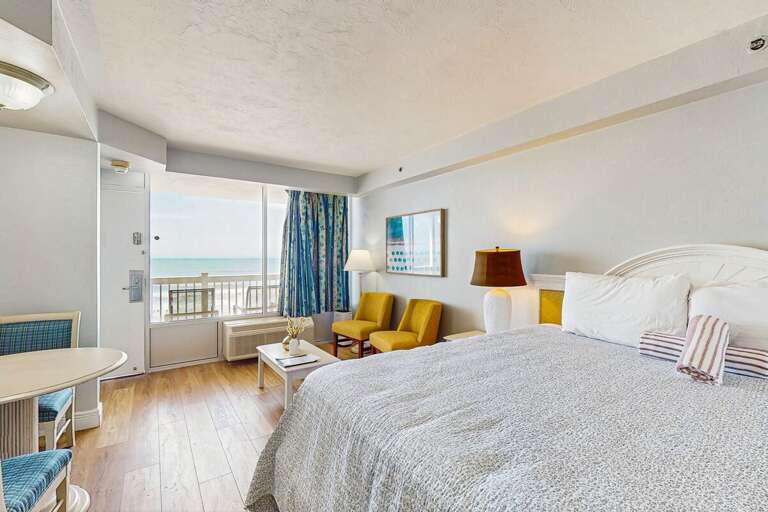 Beachfront Bedroom, Blue Balcony View, Bright Bedding