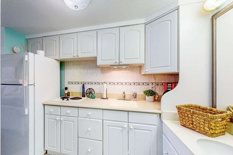 Bright, Breezy Kitchen With White Cabinets And Counter