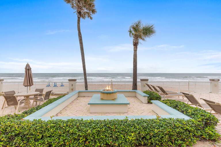 Beachfront View With Palm Trees, Fire Pit, And Seating