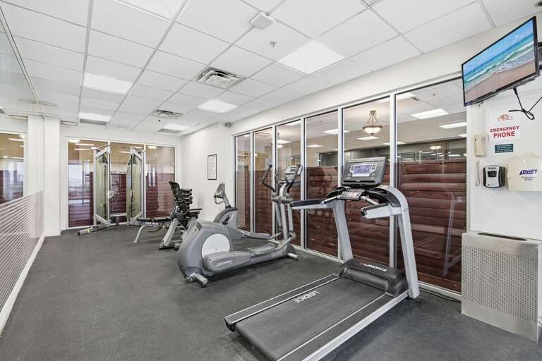 Stay active during your beach stay with this fully equipped fitness center featuring cardio machines and strength equipment—perfect for keeping your routine while enjoying a coastal getaway.