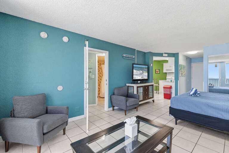 Enjoy an open-concept oceanfront studio featuring a king bed, cozy seating area, fully equipped