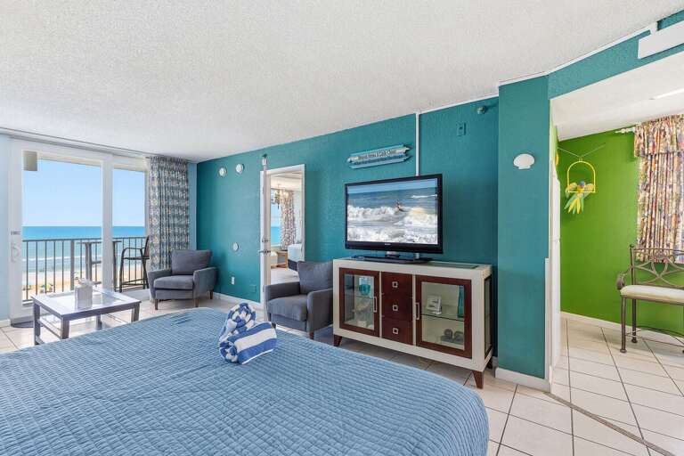 Enjoy a relaxing beach stay in this spacious oceanfront king studio featuring comfortable seating, a