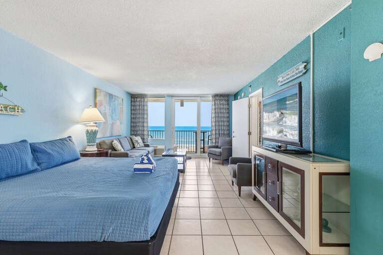 Wake up to stunning ocean views in this spacious oceanfront studio featuring a king bed, comfortable