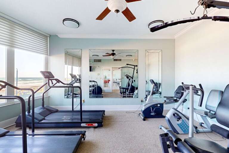 Stay active during your beach stay in this bright fitness center featuring treadmills, bikes, and stunning oceanfront views to energize every workout.