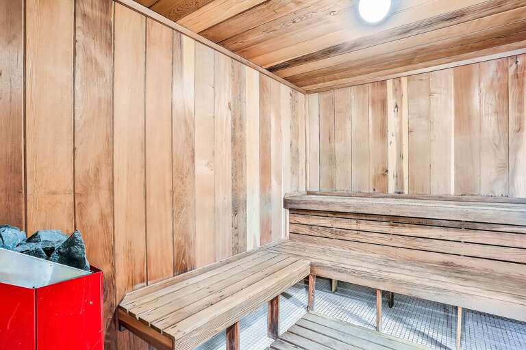 Unwind after a day on the beach in this inviting sauna, featuring warm wood interiors and soothing heat—perfect for relaxing and recharging during your beach stay.