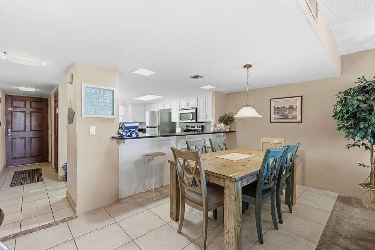 Gather for meals during your beach stay in this inviting dining area with seating for all and a