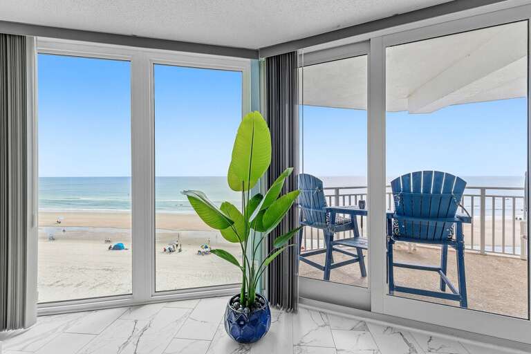 Take in breathtaking ocean views from your private beachfront balcony with comfortable Adirondack