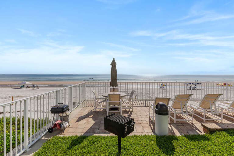 Enjoy outdoor dining at the beachfront picnic and BBQ area with direct beach access and stunning