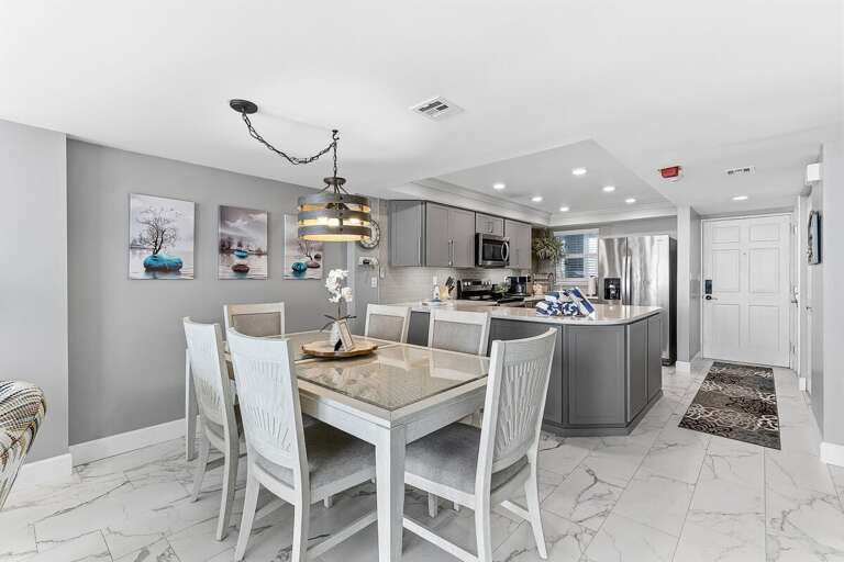 Share meals in this stylish dining area with seating for six, next to a modern kitchen with