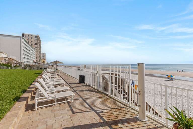 Soak up the sun on the oceanfront sundeck with lounge chairs and direct beach access just steps
