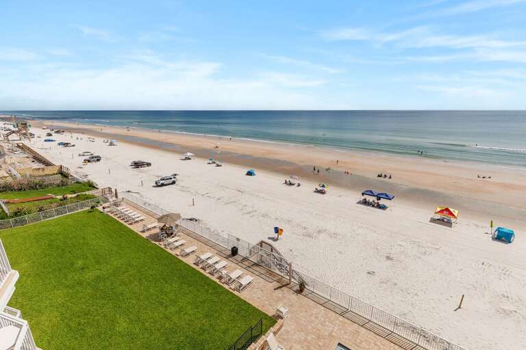 Wake up to endless ocean views and miles of sandy shoreline from this beachfront retreat. Enjoy direct beach access, sparkling Atlantic waters, and the perfect setting for a relaxing beach vacation.