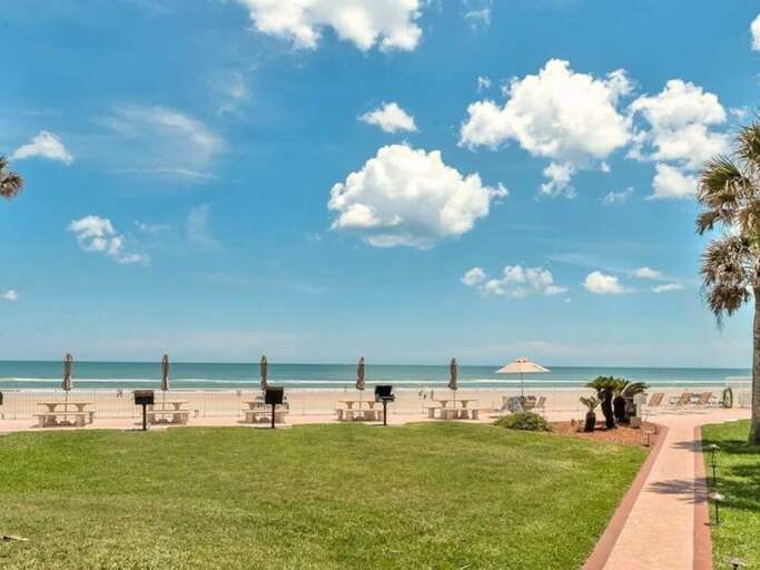 Enjoy oceanfront picnics and BBQs with family and friends at the beachfront grills and shaded tables. The perfect spot to relax, dine, and soak in the coastal breeze during your beach stay.