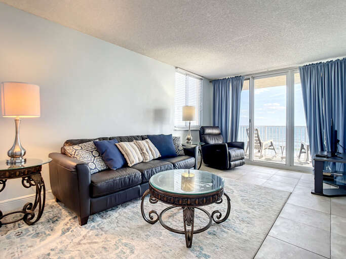 Elegant living area with comfortable seating and large windows, providing stunning ocean vistas.