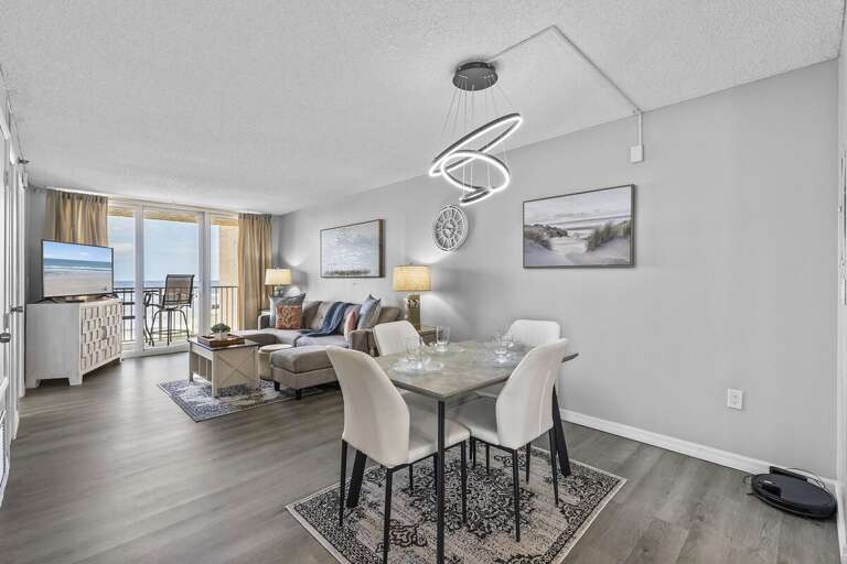 This beautifully designed open-plan living and dining area features a seamless blend of comfort and