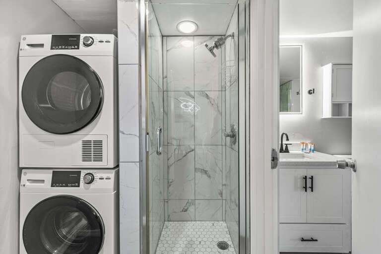 The compact design includes a convenient in-unit washer and dryer, making laundry a breeze. The