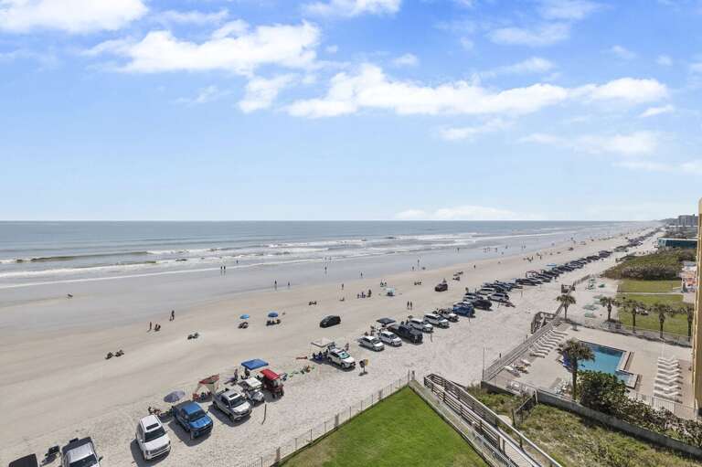 Expansive sandy beach and rolling waves, with space for relaxation and recreation.