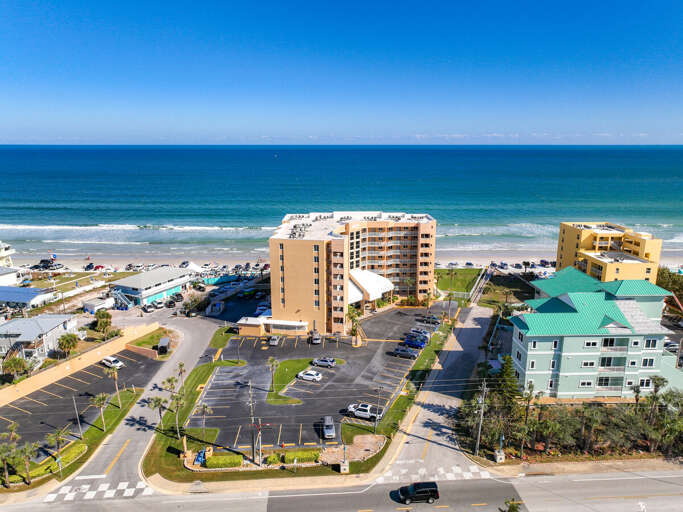 Stunning beachfront property featuring modern amenities, spacious parking, and direct access to pristine coastal waters.