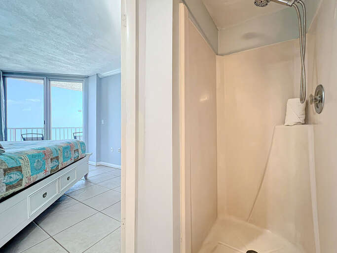 This cozy shower offers a modern design and direct access from the bedroom, blending convenience with privacy for a refreshing experience.