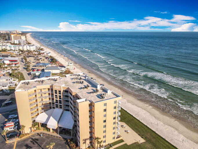 Escape to this spectacular beachfront property with breathtaking ocean views, direct beach access,