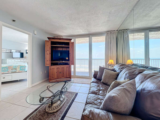 Unwind on the plush sofa while enjoying entertainment or step onto the balcony for breathtaking ocean views and refreshing breezes.