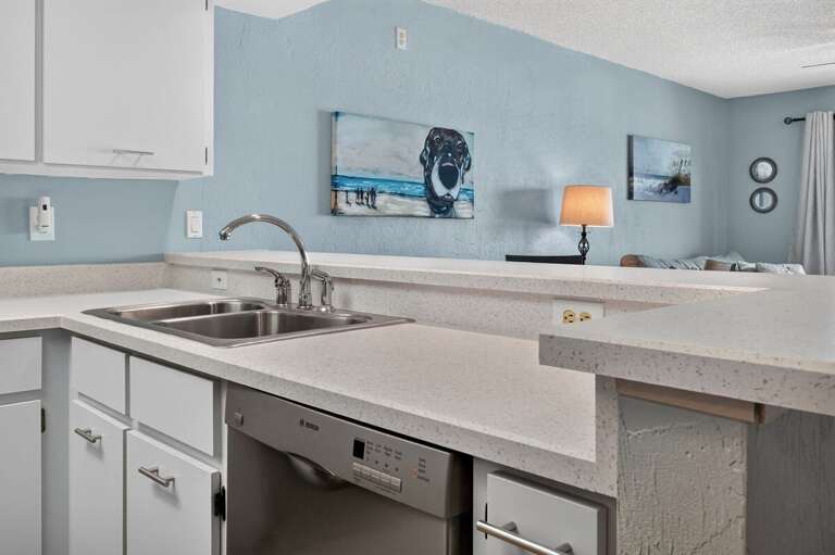 Enjoy the convenience of this open kitchen featuring generous counter space, a double sink,