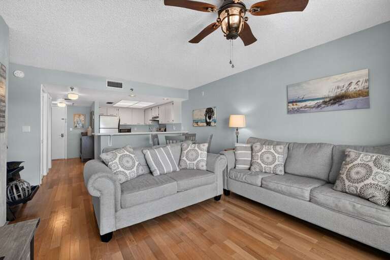 Unwind in this spacious coastal living room with comfortable seating, beach-inspired décor, and an