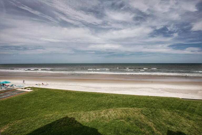 Enjoy breathtaking views of the sandy shoreline and rolling waves from this beachfront retreat—perfect for morning walks, sunbathing, or simply relaxing during your unforgettable beach stay.