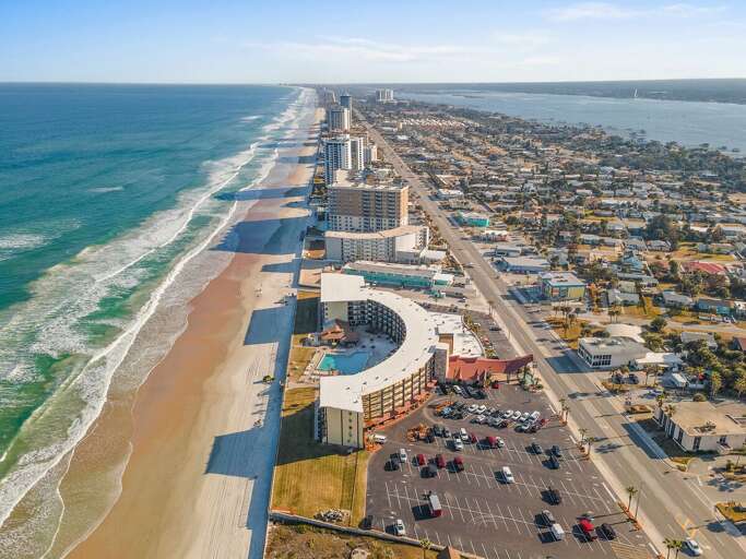 Discover the perfect beach stay with breathtaking aerial views of the coastline, direct beach
