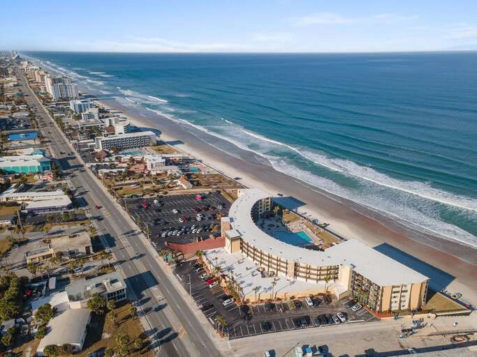Escape to this oceanfront beach stay featuring panoramic coastline views, direct beach access, and