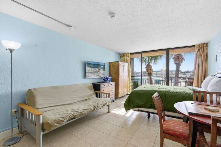 Relax in this bright beachfront studio featuring a queen bed, comfy sleeper sofa, and private