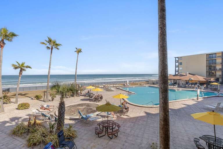Soak up the sun during your beach stay at this oceanfront resort featuring a sparkling pool, relaxing lounge areas, and direct beach access. Perfect for coastal getaways with beautiful ocean views.
