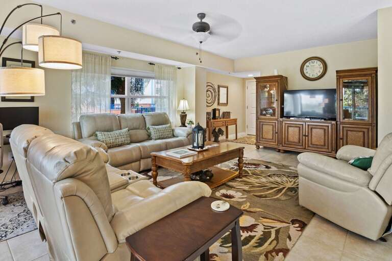 Relax after a sun-soaked beach day in this bright, coastal-inspired living room featuring plush