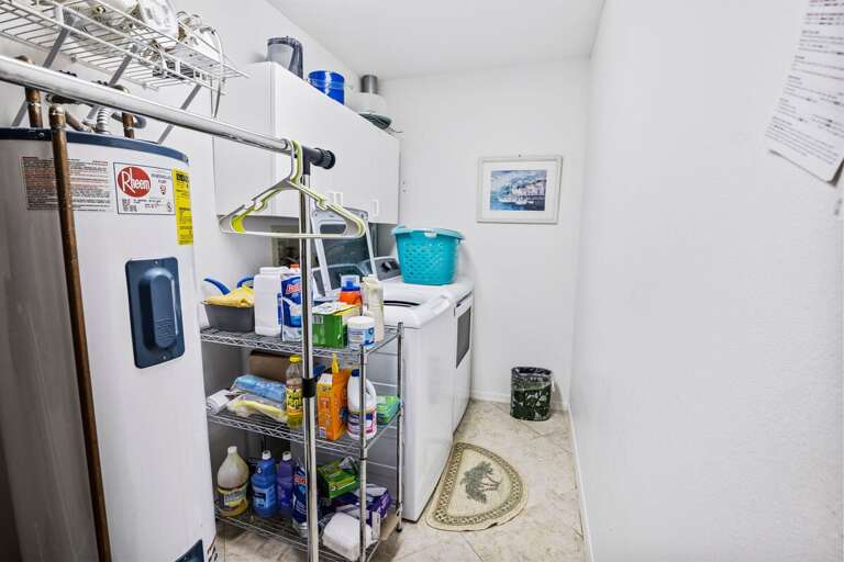 Private laundry area with washer, dryer, and storage—perfect for extended beach stays. Enjoy the convenience of fresh towels and clothes after sunny days by the shore.