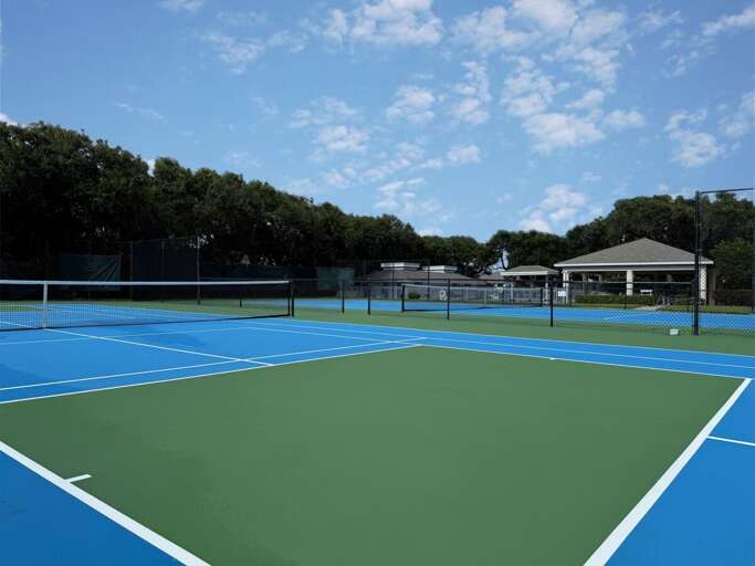 Spacious community tennis courts with clubhouse nearby, perfect for staying active during your beach stay. Enjoy a friendly match, then head to the shore for sun, sand, and relaxation.