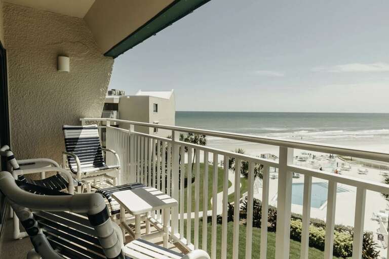 Enjoy breathtaking ocean views from this private balcony at your beach stay. Relax in comfortable