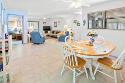 Enjoy this open-concept beach stay featuring a bright dining area and comfortable living room with