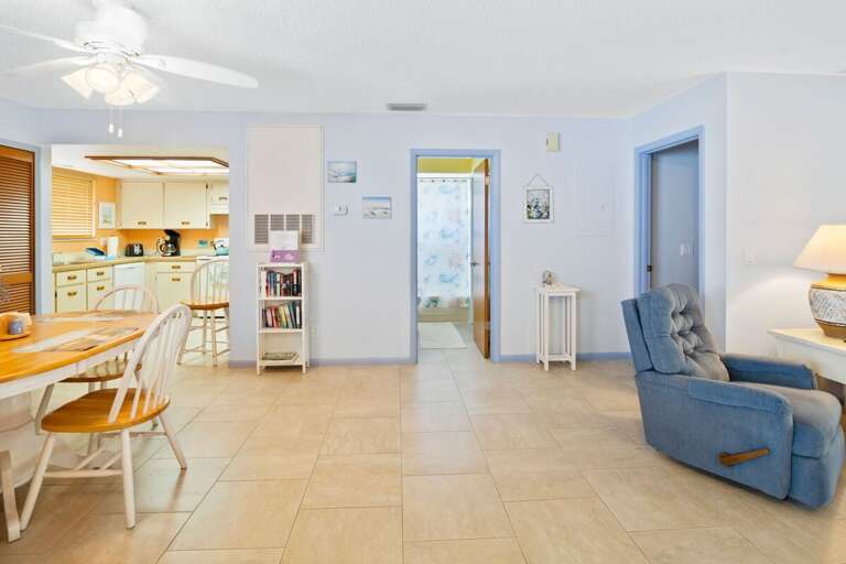 Relax in this airy beach stay featuring an open living and dining area, coastal décor, fully