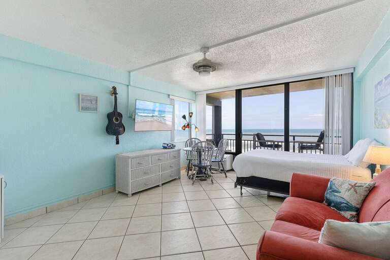 Enjoy a bright, spacious beach stay with coastal décor, comfortable seating, and oceanfront balcony access. Relax in an open-concept layout just steps from the beach with stunning water views.