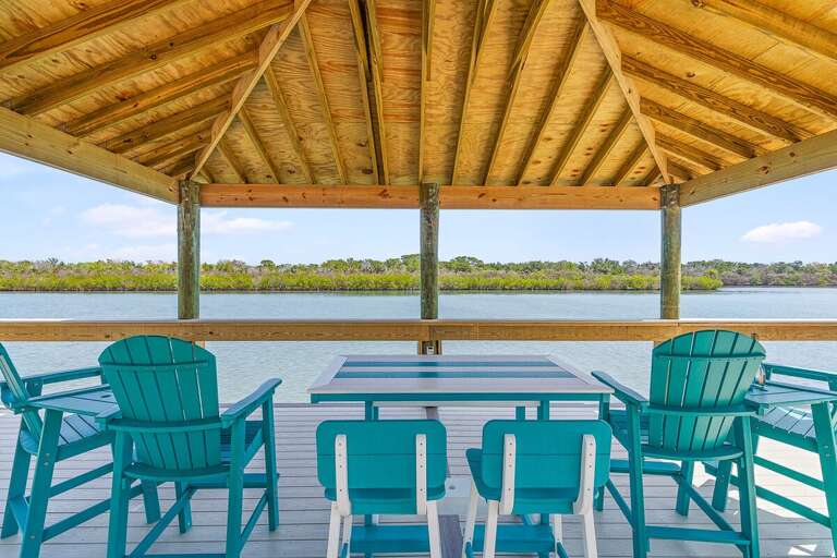 Dine and unwind during your beach stay in this covered waterfront pavilion with comfortable seating
