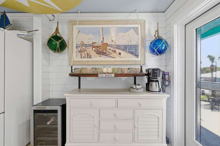 Enjoy your beach stay with this charming coffee bar featuring nautical décor, wine fridge, and