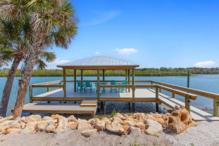 Enjoy your beach stay on this private waterfront dock with covered seating, stunning views, and