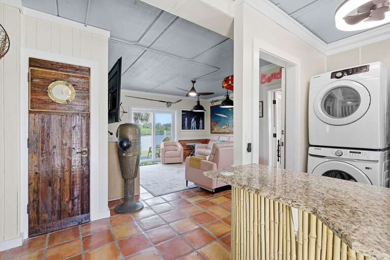 Enjoy a functional beach stay with this open-concept space featuring cozy seating, coastal décor, and in-home laundry. Perfect for relaxing and refreshing after a fun-filled day by the beach.