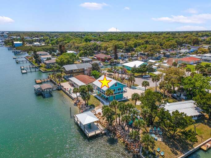 Escape to a relaxing beach stay at this waterfront home featuring a private dock, stunning coastal