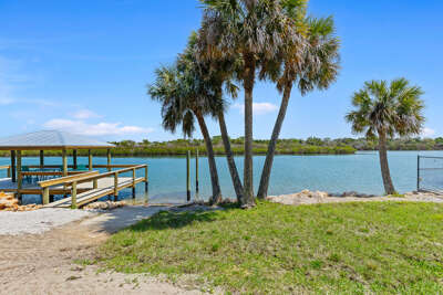 Soak in your beach stay with stunning waterfront views, a private dock, and swaying palms. Perfect for relaxing, fishing, and enjoying peaceful coastal scenery right outside your door.