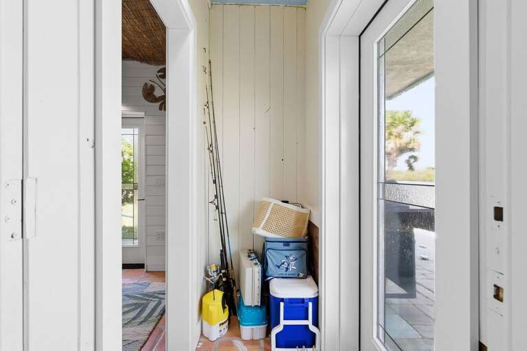 Stay organized during your beach stay with this convenient storage nook stocked for fun—perfect for fishing gear, coolers, and beach essentials, making every seaside outing easy and enjoyable.