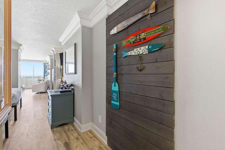 Welcoming beach stay entryway featuring charming nautical décor and coastal accents. This inviting space sets the tone for a relaxing seaside getaway just steps from the ocean.