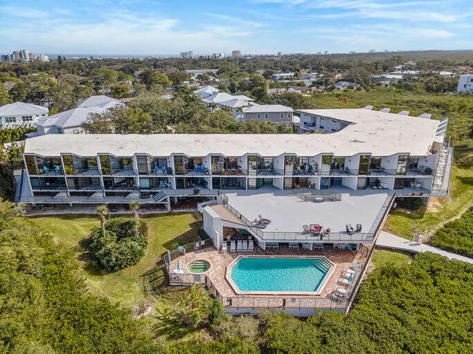 Enjoy a relaxing beach stay at this coastal condo featuring a sparkling pool, sun deck, and spacious