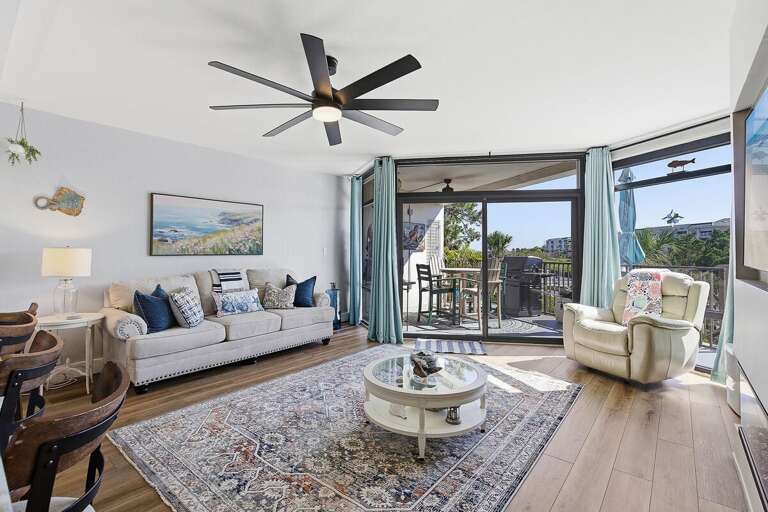 Relax in this bright beach stay retreat featuring a cozy coastal living room, stylish décor, and