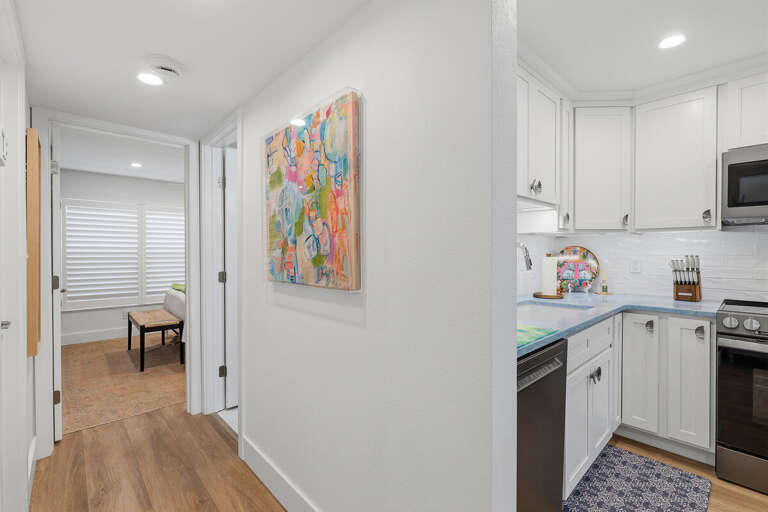 This bright beach stay features clean coastal design, easy flow between rooms, and a modern kitchen area—creating a comfortable and relaxing space for your seaside getaway.