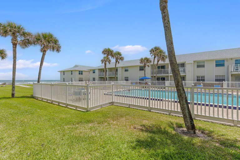Soak up the coastal lifestyle with this beach stay featuring a sparkling pool, swaying palm trees, and ocean views just steps away—perfect for relaxing seaside vacations.